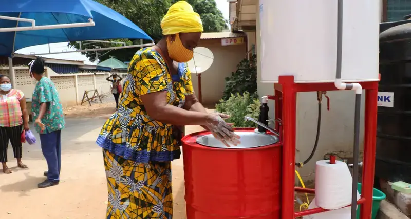A woman washing her hands